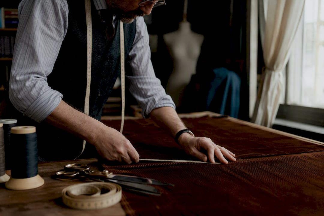Tailor measuring chestnut corduroy fabric