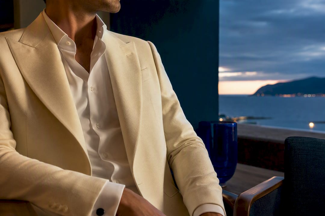 Off-white dinner jacket at seaside dusk