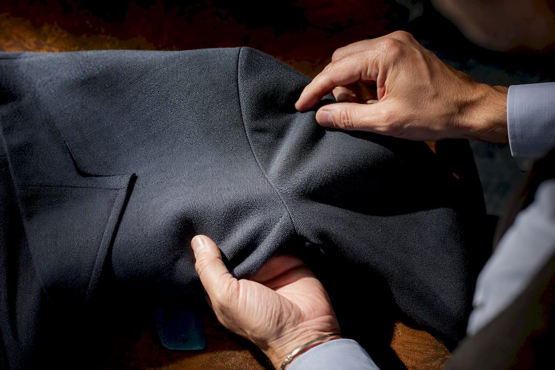 Close-up of bespoke jacket armhole fitting