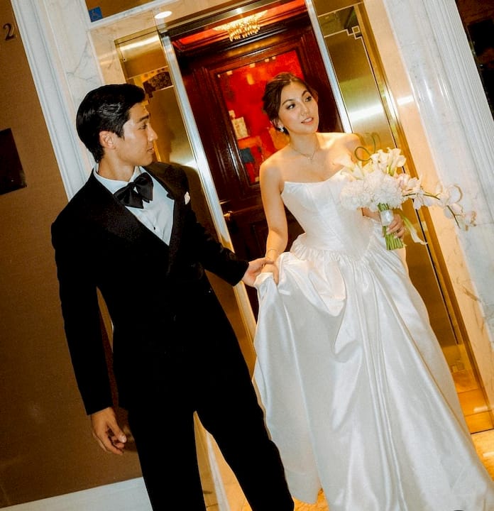 Man fitting bespoke tuxedo with tailor