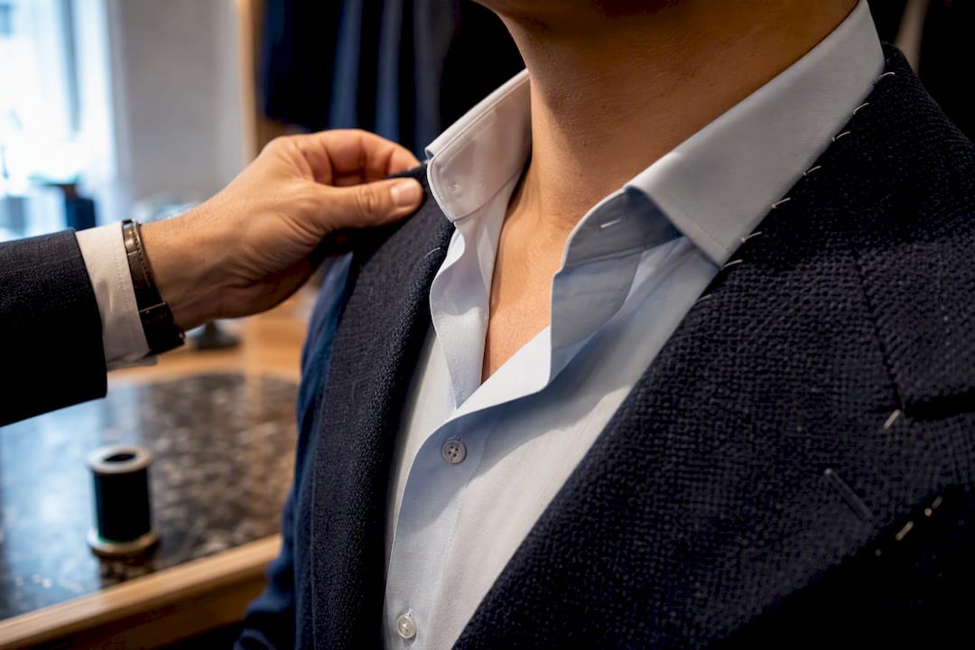 Close-up of blazer collar being fitted